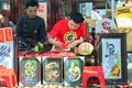 Vietnamese scholar writes calligraphy at lunar new year calligraphy festival