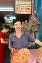 Vietnamese selling dried shrimp at a traditional wet market