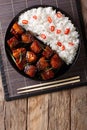 Vietnamese spicy caramel pork belly with rice closeup on a table