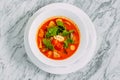 Vietnamese spicy tom yam soup on a marble table