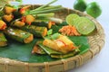 Vietnamese steamed rice pancake with shrimp on tray with banana