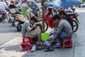 Vietnamese street shoe makers