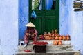 Vietnamese street vendor selling handicrafts in Hoi An, Vietnam Royalty Free Stock Photo