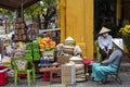 Vietnamese street vendor sells local food on the street in Hoi An, Vietnam Royalty Free Stock Photo