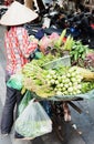 Vietnamese street vendors act and sell their vegetables and fruit products in Hanoi, Vietnam Royalty Free Stock Photo