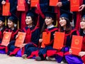 Vietnamese students celebrating graduation Royalty Free Stock Photo