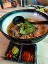 Vietnamese style noodle served with large spoon