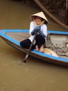 Vietnamese tourism boat woman in Mekong Delta
