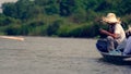 Vietnamese tourist in boat, Hanoo, Vietnam