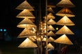 Vietnamese traditional conical hats hanging on wire for decoration. Royalty Free Stock Photo