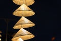 Vietnamese traditional conical hats hanging on wire for decoration. Royalty Free Stock Photo
