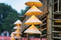 Vietnamese traditional conical hats hanging on wire for decoration. Royalty Free Stock Photo