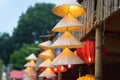 Vietnamese traditional conical hats hanging on wire for decoration. Royalty Free Stock Photo