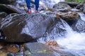 Vietnamese trekking sandal, hiking shoes on stream with rock Royalty Free Stock Photo