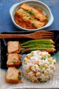 Vietnamese vegan food with fried rice and lotus seed, okra, tofu pie, simple vegetarian meal for non meat diet