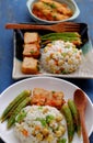 Vietnamese vegan food with fried rice and lotus seed, okra, tofu pie, simple vegetarian meal for non meat diet