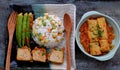 Vietnamese vegan food with fried rice and lotus seed, okra, tofu pie, simple vegetarian meal for non meat diet