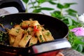 Vietnamese vegetarian dish, fried tofu cook with sauce and ginger, simple vegan dish on pan