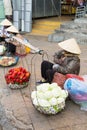 Vietnamese vendors selling fruit and vegetables