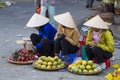 Vietnamese vendors selling fruit and vegetables at Dalat market