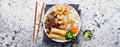 Vietnamese vermicelli rice noodle with grilled beef and shrimp with crispy rolls