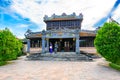 Vietnamese woman explaining the Citadel, Imperial City Hue, Vietnam, to a tourist.