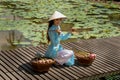 Vietnamese woman with lotus basket