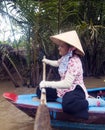 Vietnamese woman paddling at Mekon Delta Royalty Free Stock Photo