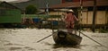 Vietnamese woman paddling on the Mekong river, Vietnam