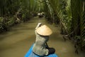 Vietnamese woman rowing a boat