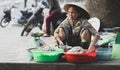 Vietnamese woman selling fish on street Royalty Free Stock Photo