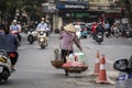 Vietnamese woman selling food on the street market of old town in Hanoi, Vietnam Royalty Free Stock Photo