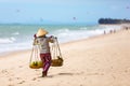 Vietnamese woman selling Fruits at Mui Ne beach. Vietnam