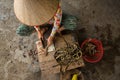 Vietnamese woman slices eels