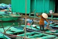 A Vietnamese woman standing on Bamboo boat