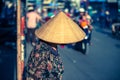 Vietnamese woman in triangular hat