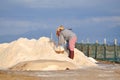 Vietnamese women are burdening hard to collect salt from the extract fields to the storage fields