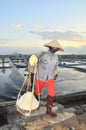 Vietnamese women are burdening hard to collect salt from the extract fields to the storage fields