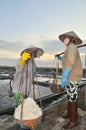 Vietnamese women are burdening hard to collect salt from the extract fields to the storage fields