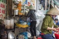 Vietnamese women prepare food at a street soup shop in Ho Chi Minh City, Vietnam