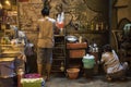 Vietnamese women sell beverages at night in an alley in Ho Chi Minh City, Vietnam