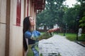 Vietnamese women wear Ao dai in the rain