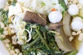 Vietnamse noodle soup, served with fresh herbs at the buddhist eatery, radish, morning glory, shiitake and tofu in white bowl on W