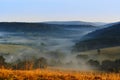 Viev of beautiful fog in the morning. Trees in the shadow of the fog. Beautiful landscape of the Beskidy mountains, Poland Royalty Free Stock Photo