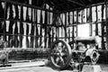 View into abandoned old saltpeter factory hall with corrugated rusty metal walls and vintage machine - Humberstone ghost town, Royalty Free Stock Photo