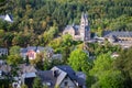 View of the Abbey of St. Maurice and St. Maurus of Clervaux Clervaux Abbey in Luxembourg, with houses in the middle of the Royalty Free Stock Photo