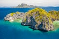 View from above, aerial view of unknown Island surrounded by turquoise, crystal clear sea. Bacuit Bay, El Nido, Palawan, Royalty Free Stock Photo