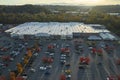 View from above of american grocery store with many parked cars on parking lot with lines and markings for parking Royalty Free Stock Photo