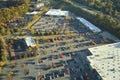 View from above of american grocery store with many parked cars on parking lot with lines and markings for parking Royalty Free Stock Photo