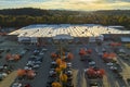 View from above of american grocery store with many parked cars on parking lot with lines and markings for parking Royalty Free Stock Photo